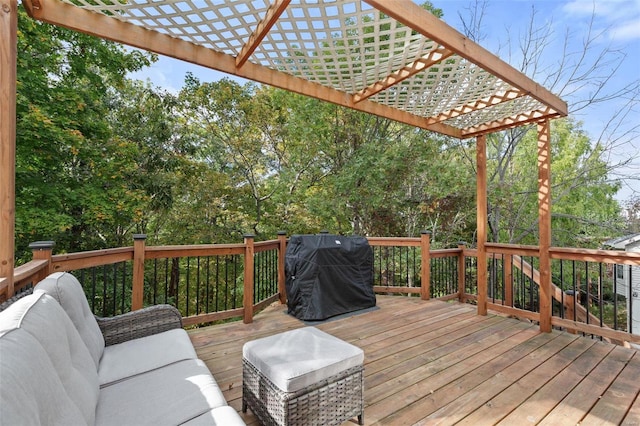 wooden deck featuring area for grilling, an outdoor living space, and a pergola