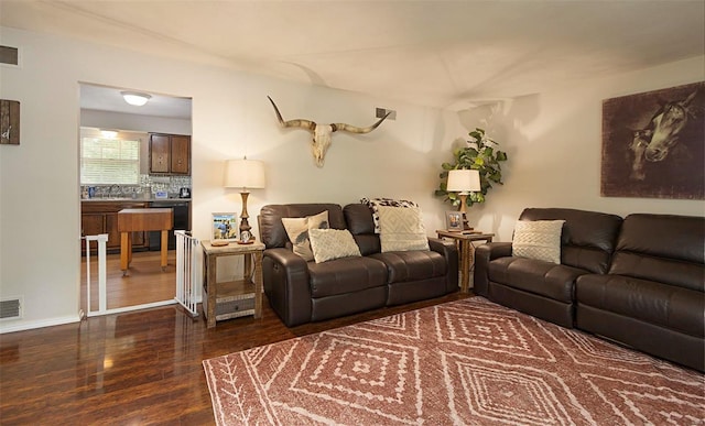 living room with dark hardwood / wood-style floors