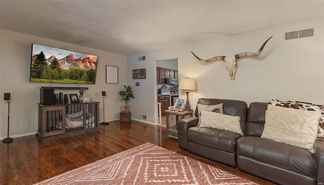 living room featuring dark hardwood / wood-style flooring