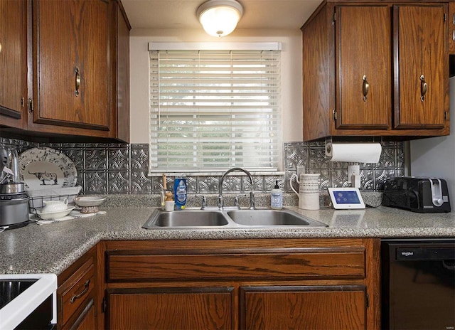 kitchen featuring range, black dishwasher, sink, and tasteful backsplash