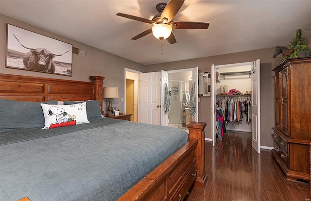 bedroom featuring ceiling fan, a walk in closet, a closet, ensuite bathroom, and dark hardwood / wood-style flooring