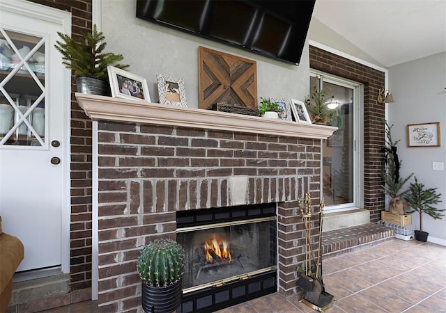 interior details with a fireplace and tile patterned flooring