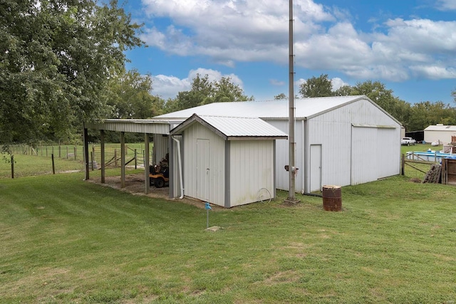 view of outdoor structure with a lawn