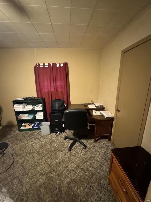 carpeted office space featuring a drop ceiling