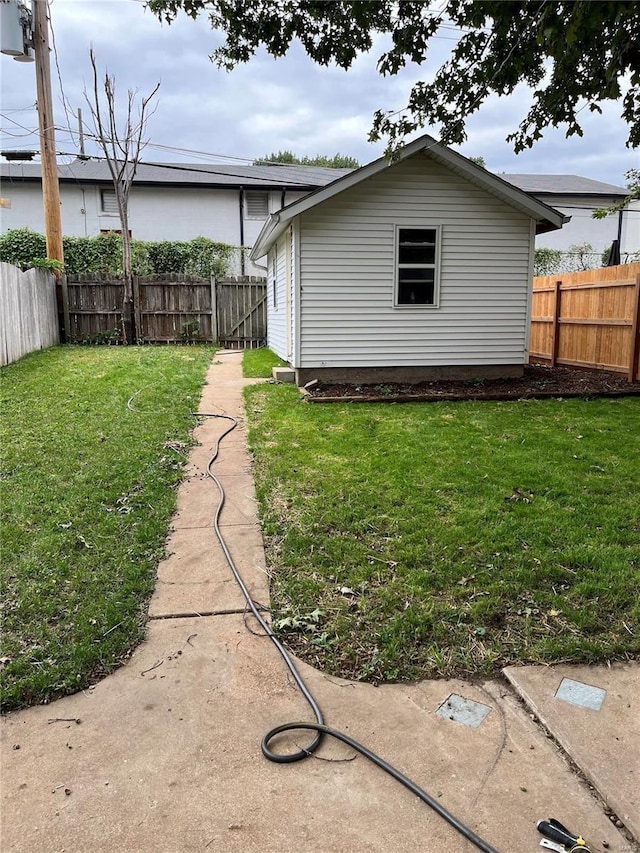 view of home's exterior with a lawn