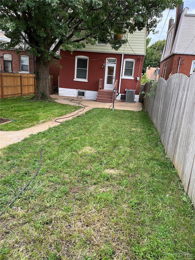 view of yard featuring central AC