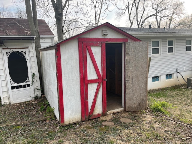 view of outbuilding with central AC