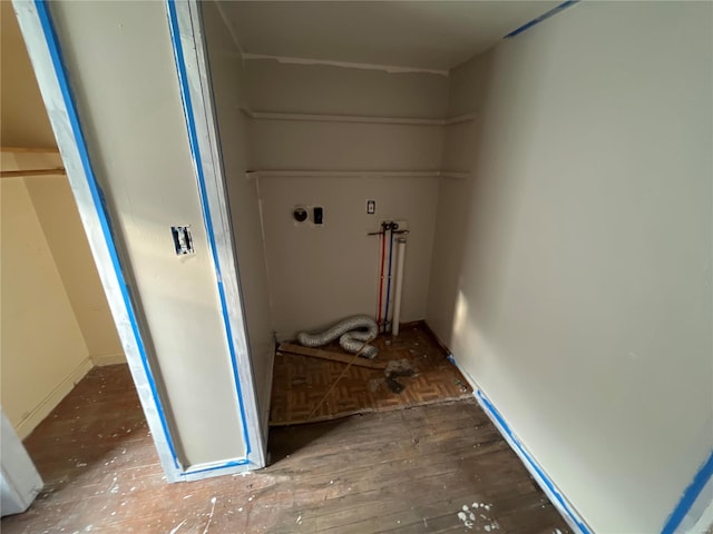 washroom with washer hookup and hardwood / wood-style flooring