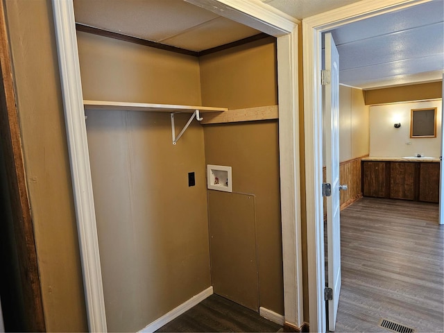 laundry area featuring hookup for a washing machine, dark wood-type flooring, and sink