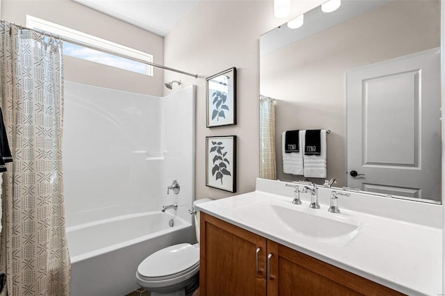 full bathroom with vanity, toilet, and shower / bath combo