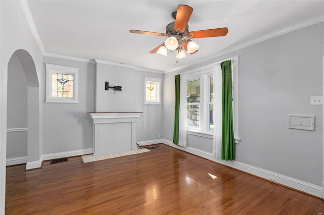 unfurnished living room featuring ceiling fan, hardwood / wood-style flooring, and crown molding