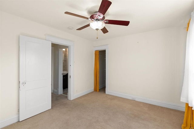 carpeted empty room with ceiling fan