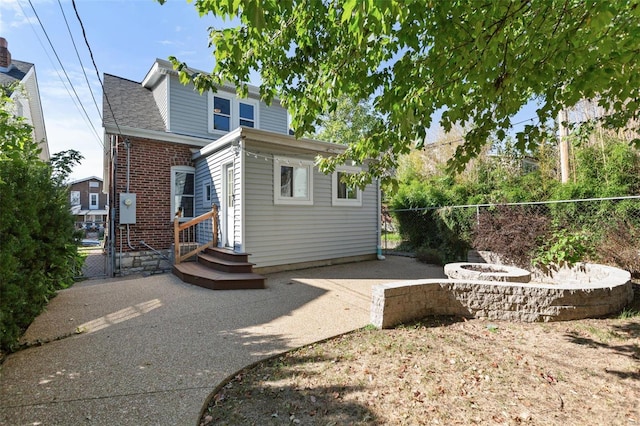 back of property with a patio