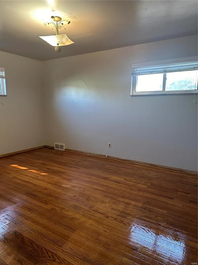 spare room featuring dark hardwood / wood-style floors