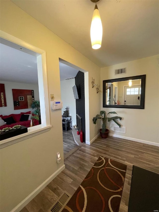 hallway featuring dark hardwood / wood-style flooring