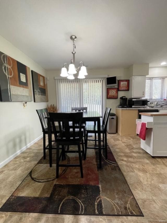 dining room with a chandelier