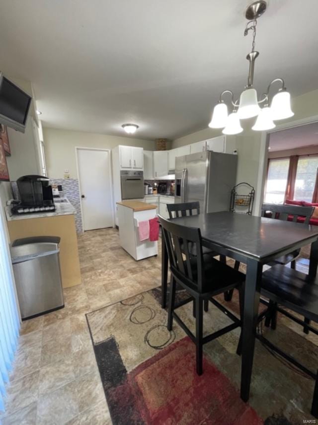 dining area featuring a chandelier