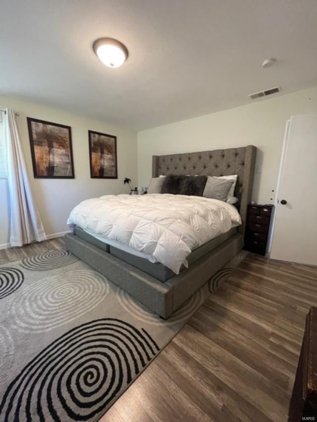 bedroom featuring wood-type flooring