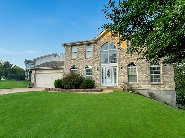 colonial-style house with a garage and a front lawn