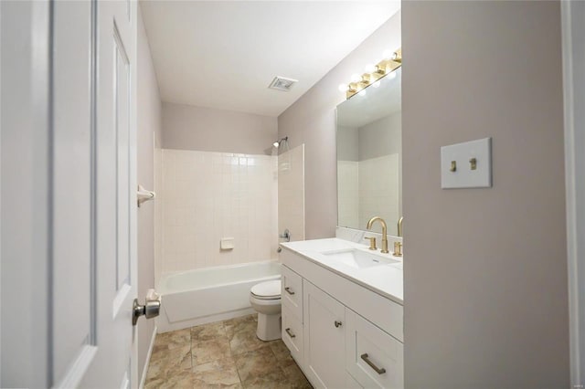 full bathroom with toilet, tiled shower / bath, and vanity