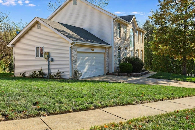 view of property exterior featuring a yard and a garage