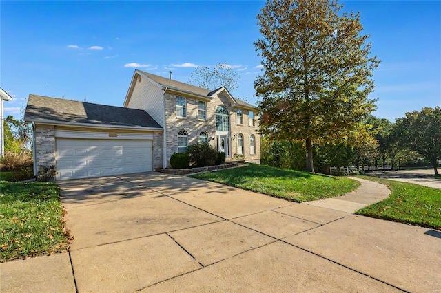 view of front of house with a front lawn and a garage