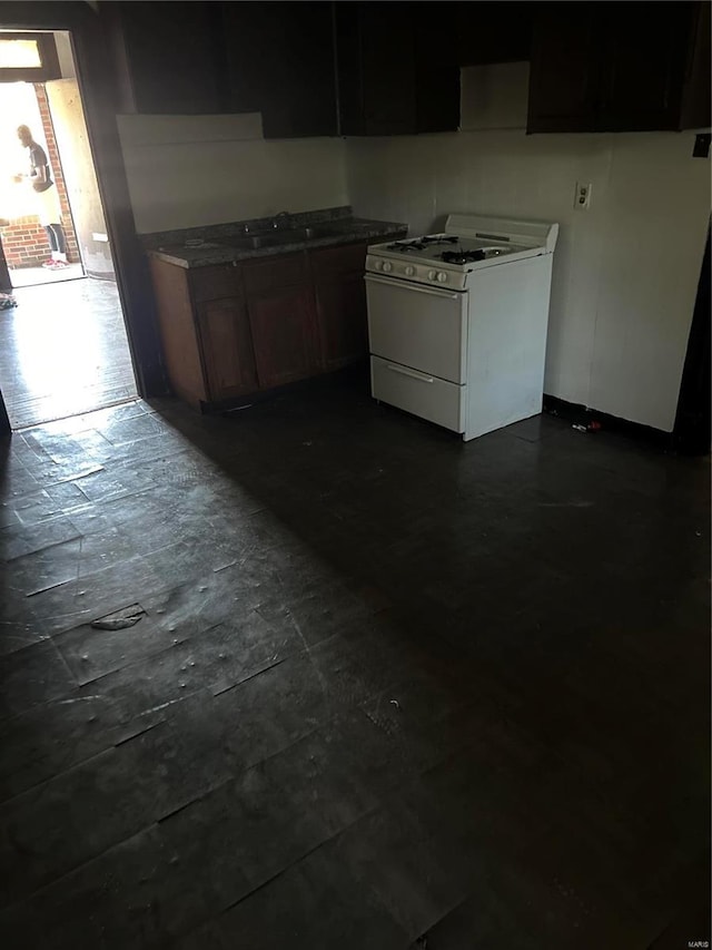 kitchen featuring sink and gas range gas stove