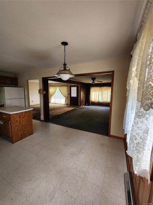 foyer entrance featuring ceiling fan