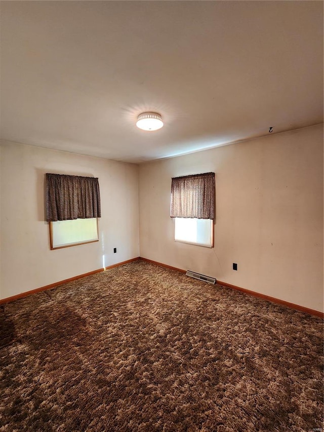 unfurnished room featuring carpet