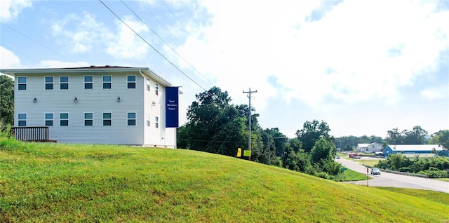 view of home's exterior featuring a lawn