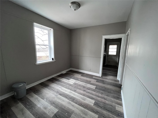 spare room featuring dark hardwood / wood-style floors