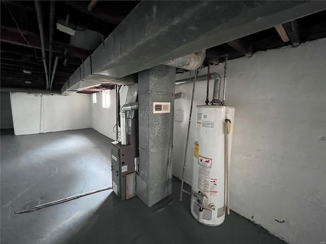 utility room with gas water heater and heating unit