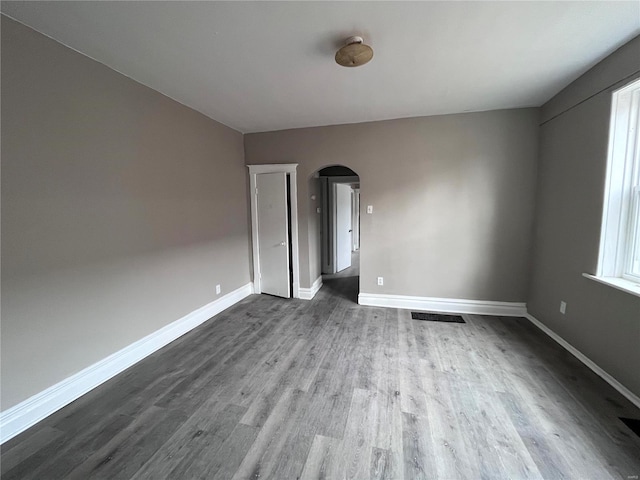 unfurnished room featuring hardwood / wood-style flooring