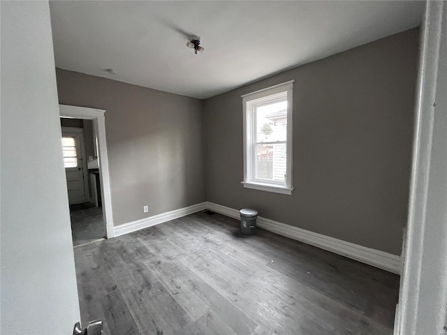 unfurnished room with hardwood / wood-style floors