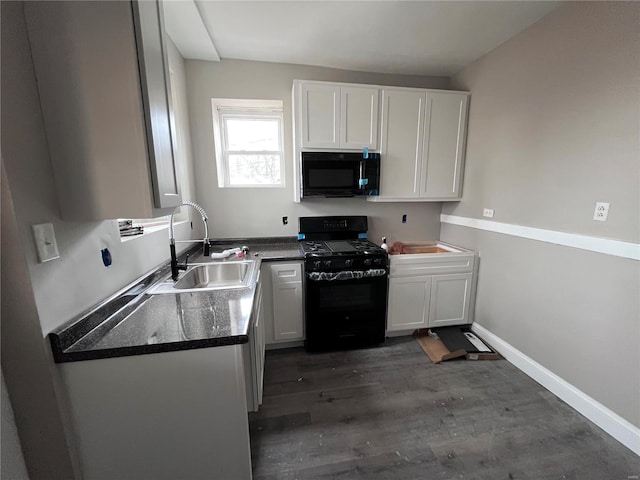 kitchen featuring white cabinets, sink, dark wood-type flooring, and black appliances