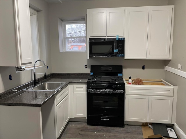 kitchen with white cabinets, sink, dark hardwood / wood-style floors, and black appliances