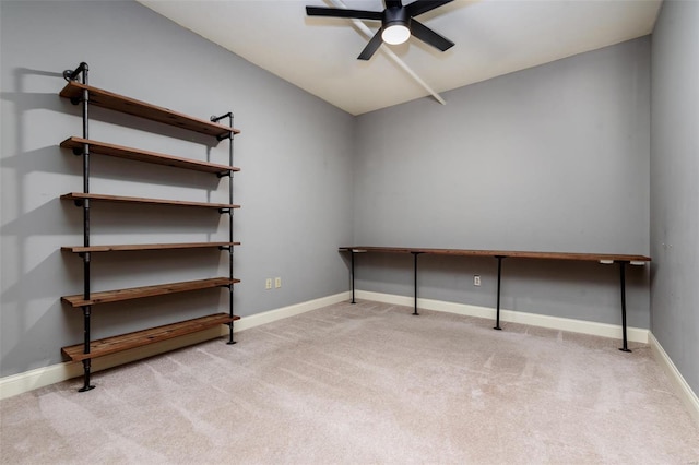 unfurnished room featuring light carpet, baseboards, a ceiling fan, and lofted ceiling