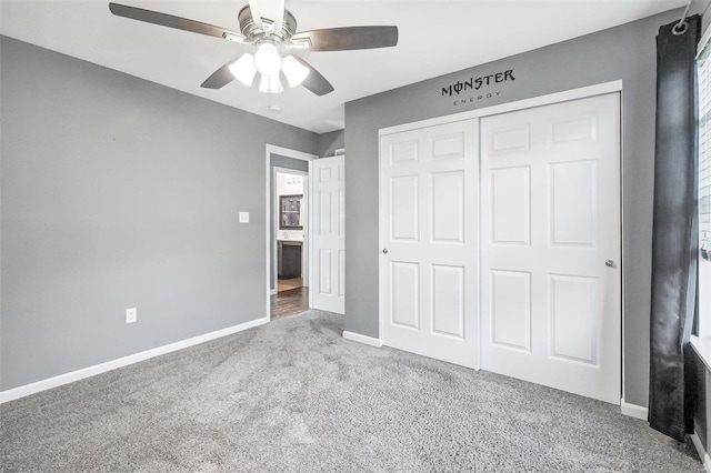 unfurnished bedroom featuring light colored carpet, a closet, and ceiling fan