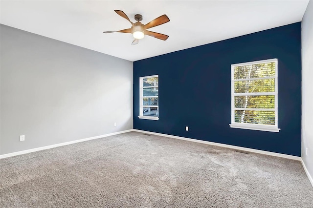 carpeted empty room with ceiling fan