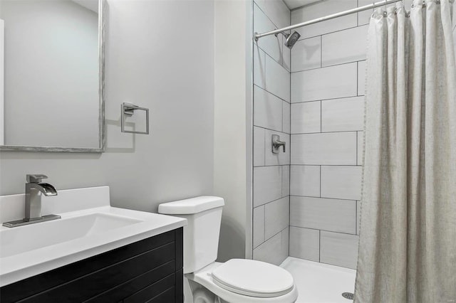 bathroom with vanity, toilet, and a shower with shower curtain