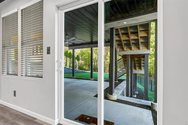 entryway featuring hardwood / wood-style floors, ceiling fan, and a wealth of natural light