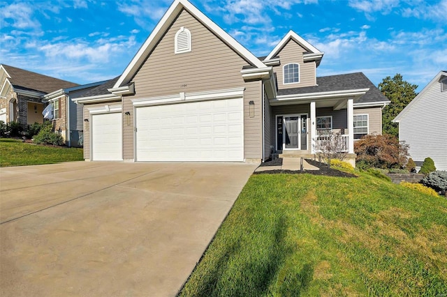 view of front facade featuring a front lawn, covered porch, and a garage