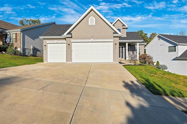 view of front of house featuring a front lawn and a garage