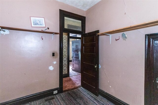 view of carpeted entrance foyer