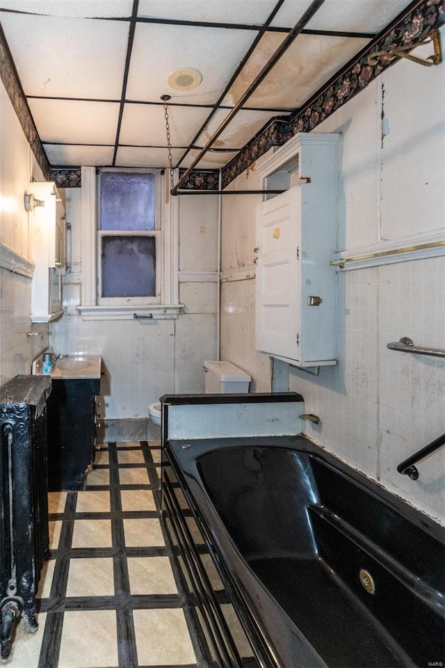 interior space featuring white cabinetry and radiator heating unit