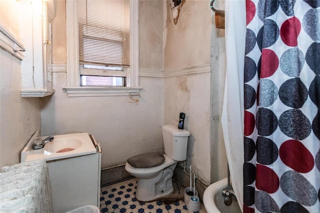 bathroom featuring vanity, toilet, and walk in shower