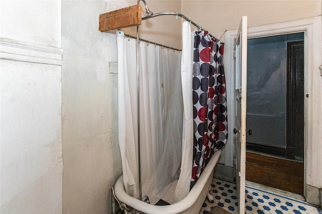 bathroom with tile patterned floors and a shower with curtain