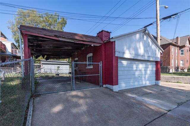 garage featuring a carport