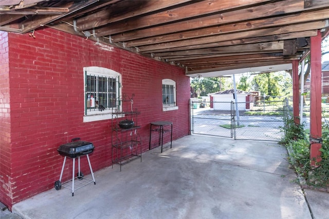 view of patio / terrace with an outbuilding and a garage