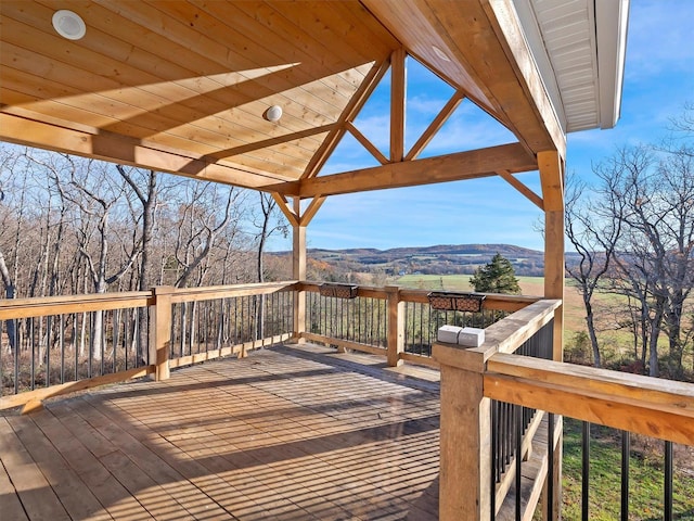 wooden deck featuring a mountain view